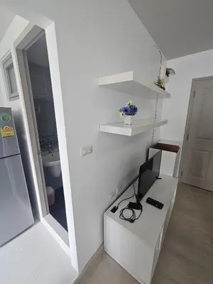 a white room with a desk with a computer on it at Dcondo in Ban Kathu