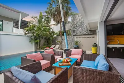 a patio with furniture and a swimming pool at 3 BR Pool Villa Kloua near Chalong Temple in Ban Na Bon
