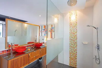 a bathroom with two red sinks and a shower at 3 BR Pool Villa Kloua near Chalong Temple in Ban Na Bon