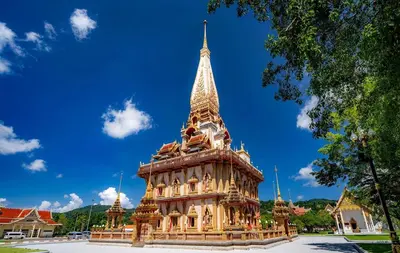 a large building with a steeple on top of it at 3 BR Pool Villa Kloua near Chalong Temple in Ban Na Bon