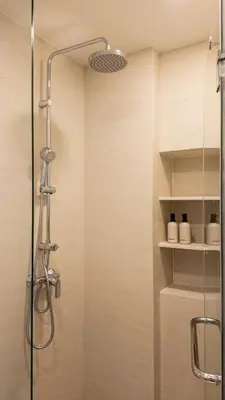 a shower with a glass door in a bathroom at Natural Harmony - SkyPark Celeste in Laguna Phuket