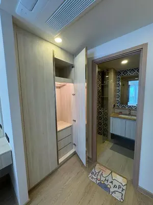 a bathroom with a shower and a sink and a mirror at Пляж Бангтао Резиденция Ozon in Laguna Phuket