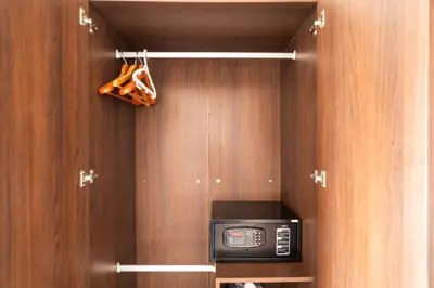 a kitchen with a microwave in a wooden cabinet at Patong hillside Condo with pool, bar, parking in Patong Beach