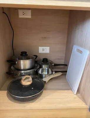 two pots and pans on a shelf in a kitchen at Wyndham apartment Naithon in Nai Thon Beach