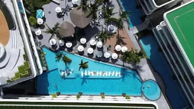 an overhead view of the swimming pool at a resort at Lamia 1BR Suite at Kora Beach Resort in Layan Beach