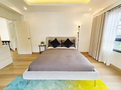 a bedroom with a large bed in a room at Boutique pool villa in Soi Bell,Kamala in Kamala Beach