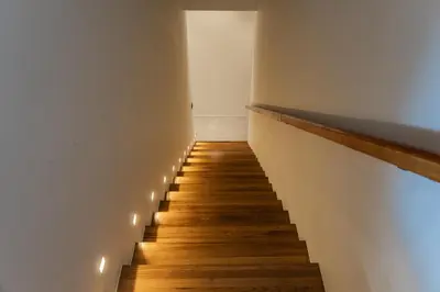 a hallway with a staircase with lights on it at PRAIA Residence 5BR - Bangtao in Ban Pak Lak