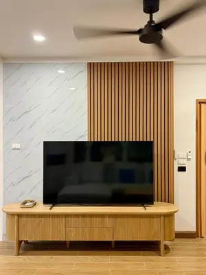 a large flat screen tv sitting on top of a table at KONE- 3BR Private Pool Villa Kathu near Patong in Ban Kathu