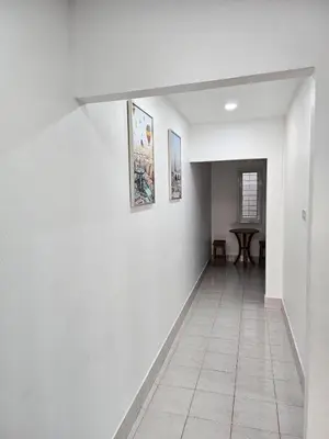 a hallway with white walls and a tile floor at Large 1 Bedroom Apt Sleeps 4, Close to Beach - RM 2 in Ban Lum Fuang