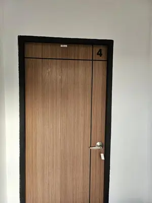 a wooden door with a arrow on it at Large 1 Bedroom Apt, Sleeps 4, close to beach - RM 4 in Ban Lum Fuang