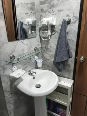 a bathroom with a sink and a mirror at 777 Condo Phuket in Ban Mai Salae