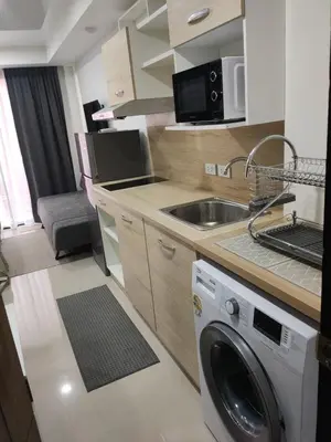 a kitchen with a washing machine and a sink at 777 Condo Phuket in Ban Mai Salae