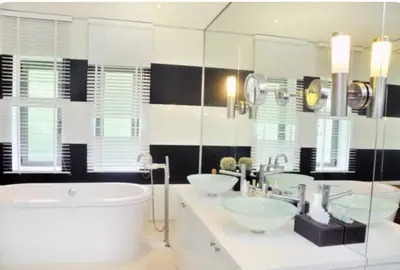 a bathroom with two sinks and a large tub at Atika Villa 6 ocean view pool villa in Patong Beach