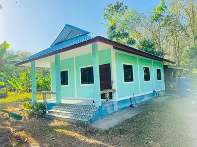 a small house with a blue and green at SINTO Homestay Yao Noi in Ko Yao Noi