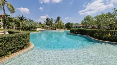 a swimming pool with blue water in a resort at Desiner Villa in Laguna Village, Bang Tao Beach, Phuket in Layan Beach