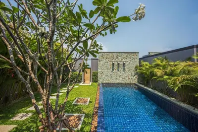a swimming pool in the backyard of a villa at VILLA Miriama 2 Bedroom Near Naiharn Beach in Rawai Beach