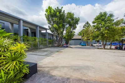 a parking lot in front of a building at VILLA Miriama 2 Bedroom Near Naiharn Beach in Rawai Beach