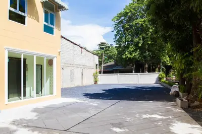 a driveway in front of a building at Le Hua Hotel in Phuket Town
