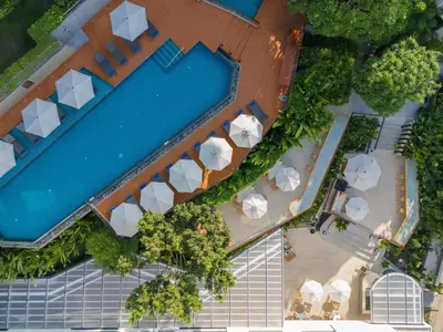 an overhead view of a pool at a resort at Andaman Beach Hotel Phuket - Handwritten Collection by Accor in Patong Beach