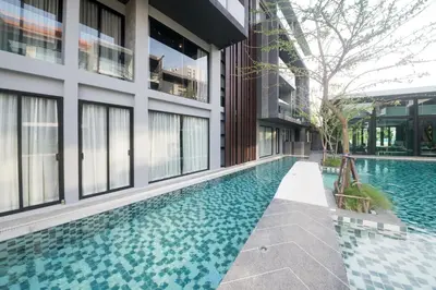 a swimming pool in the middle of a building at Maya Phuket Airport Hotel-Naiyang Beach in Nai Yang Beach