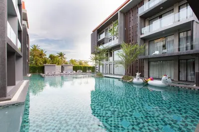 a swimming pool in the middle of a building at Maya Phuket Airport Hotel-Naiyang Beach in Nai Yang Beach