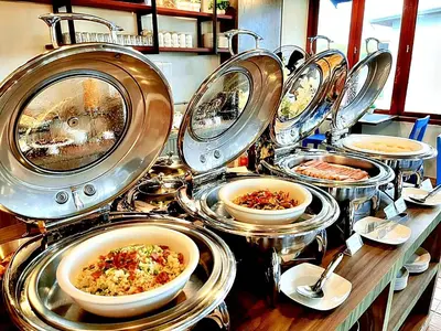 a bunch of plates of food on a table at The Sixteenth Naiyang Beach Hotel- Free Schedule Airport Shuttle in Nai Yang Beach
