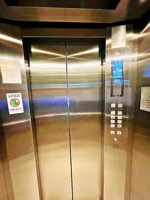 a close up of a stainless steel elevator at The Sixteenth Naiyang Beach Hotel- Free Schedule Airport Shuttle in Nai Yang Beach