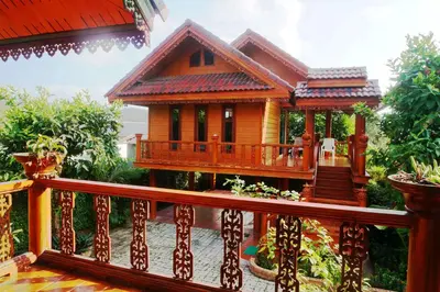 a small house on a wooden deck at Ruen Tai Boutique in Nai Yang Beach
