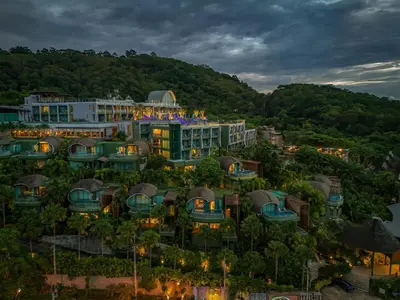 an aerial view of the resort at dusk at Crest Resort & Pool Villas - SHA Extra Plus in Patong Beach
