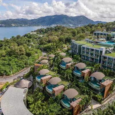 an aerial view of the resort and the water at Crest Resort & Pool Villas - SHA Extra Plus in Patong Beach
