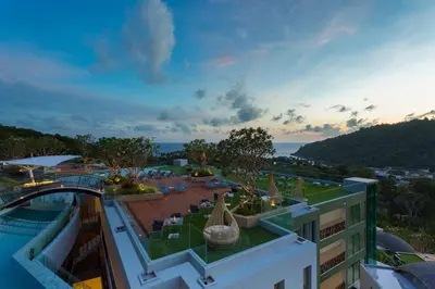 a view of a building with a swimming pool at Crest Resort & Pool Villas - SHA Extra Plus in Patong Beach