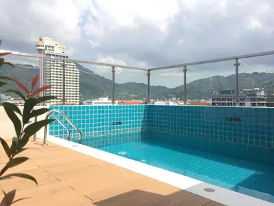 a swimming pool on the roof of a building at Centro One Bangla in Patong Beach