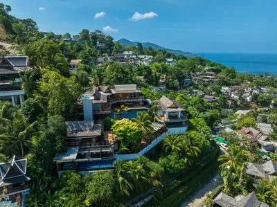 an aerial view of a resort with the ocean in the background at Luxury 4 pool Seaview 6 bedroom Villa on Surin Hill in Surin Beach