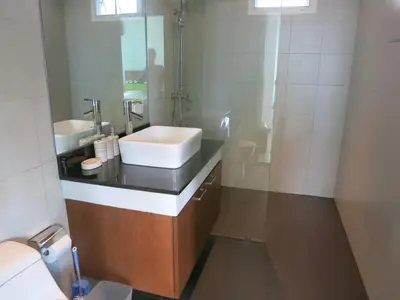 a bathroom with a sink and a mirror at Residence Harmonie in Rawai Beach