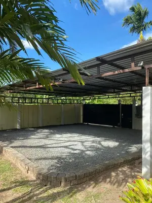 a pergola over a patio in a house at Bann Jai Dee in Nai Yang Beach