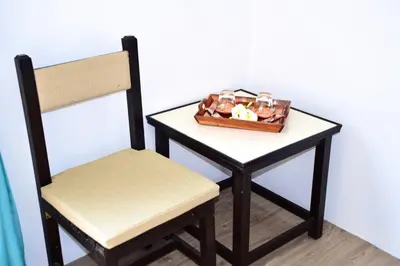 a small table with a chair and a tray of food at Wan Wan Place in Ao Nang Beach