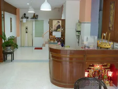 a lobby of a pharmacy with a counter in the middle at Wan Wan Place in Ao Nang Beach
