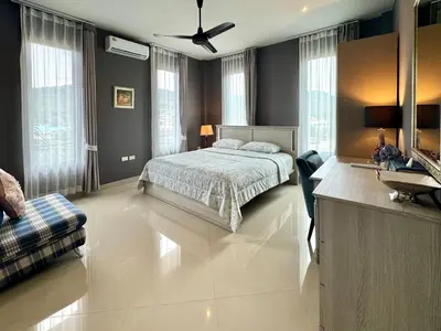 a bedroom with a bed and a sink in it at Klong Muang Beach Apartment in Klong Muang Beach