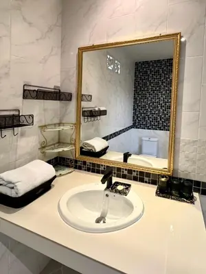 a bathroom with a sink and a mirror at Klong Muang Beach Apartment in Klong Muang Beach