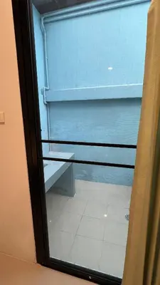 a window with a view of a window with a blind at 3B Apartment-SHA Extra Plus in Kamala Beach