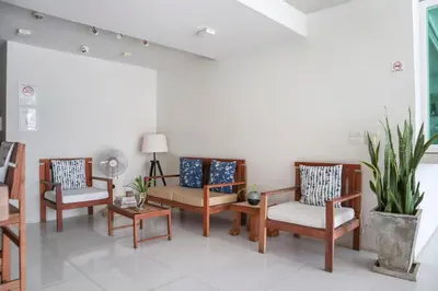 a living room with three chairs and a table at Wabi Sabi Boutique Hotel - SHA Extra Plus in Kamala Beach