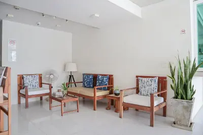 a group of chairs and tables in a room at Wabi Sabi Boutique Hotel - SHA Extra Plus in Kamala Beach