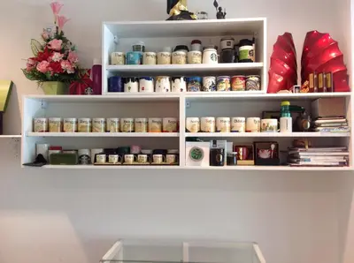 a shelf in a room with jars on it at 217@HKT in Phuket Town