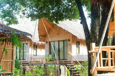 a bamboo house with a thatched roof at Anyavee Krabi Beach Resort in Klong Muang Beach