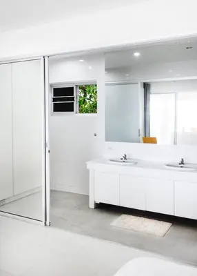 a white bathroom with two sinks and a mirror at Kata Top Villas in Kata Beach