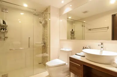 a bathroom with a sink and a toilet and a shower at The Title KR Beach Condotel Rawai Beach in Rawai Beach