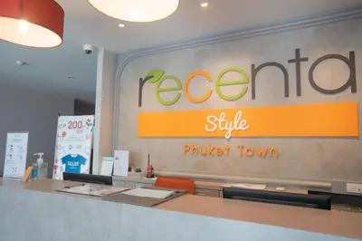 a restaurant sign on the wall of a store at Recenta Style Phuket Town in Phuket Town