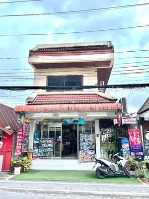 a scooter parked in front of a store at JJ karon beach hotel in Karon Beach