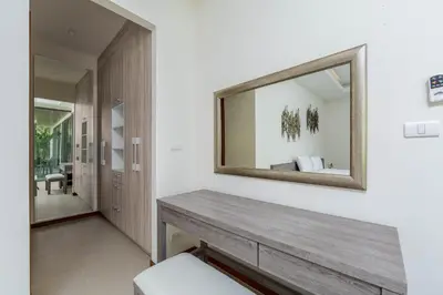a mirror on the wall of a bathroom at Laem Ka Residence by Tropiclook in Rawai Beach