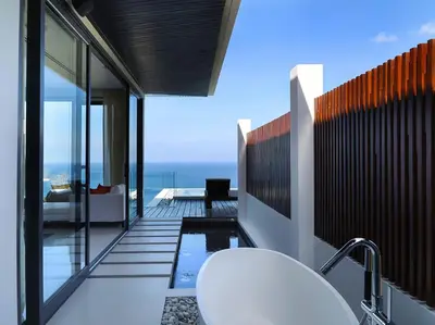 a bathroom with a view of the ocean from a house at Villa Saan - SHA Extra Plus in Kamala Beach